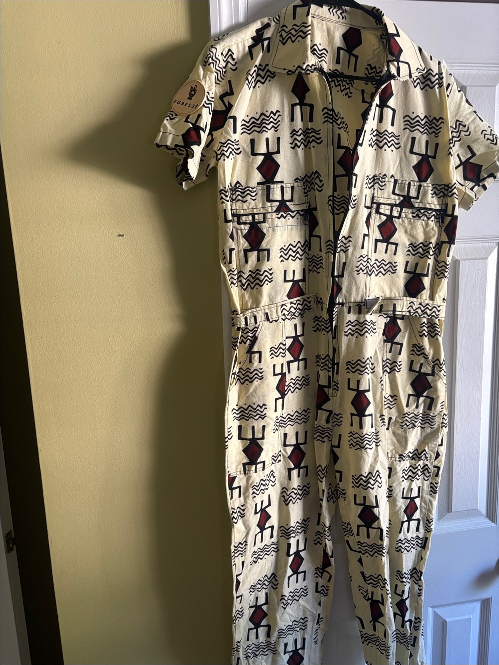 Cream Straight-Leg Jumpsuit with Graphic Red & Black Print